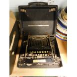 A LC Smith Corona cased typewriter.