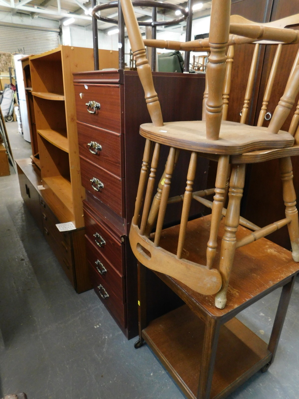 A collection of furniture, to include a pine open bookcase, low sideboard, two chairs, two tier