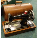 An oak cased Singer sewing machine.