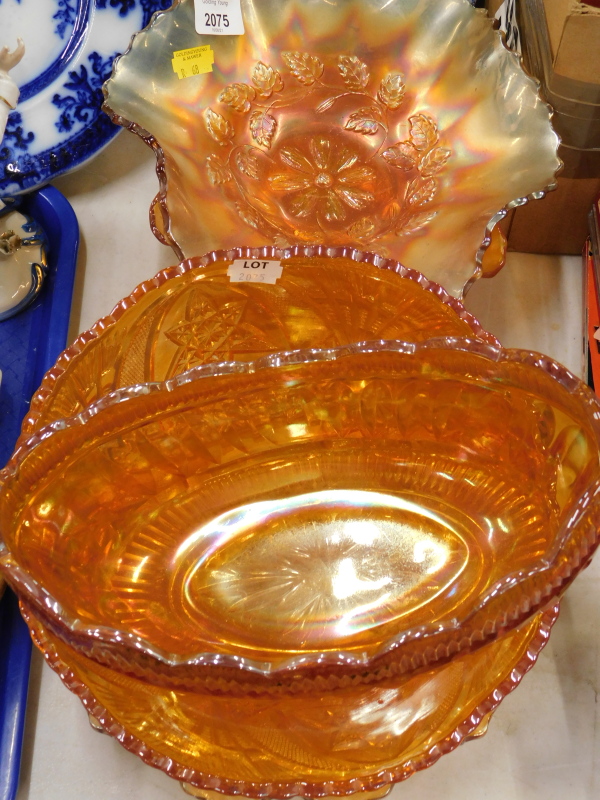 A collection of carnival glass, to include various fluted edge bowls, etc., (a quantity).