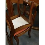 A pair of Victorian mahogany dining chairs, with drop in seats.