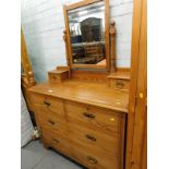 A Victorian pitch pine dressing table, with mirror back and two short and three long drawers, with