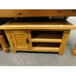 A modern light oak low cabinet, with a single hinged door and inner shelf, 50cm high, 90cm wide,