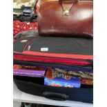 A mid 20thC leather briefcase/satchel, various ladies handbags, clothing, games to include Boggle, 6