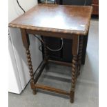 An oak occasional table, with a square top, with pie crust border, on barley twist legs, the top