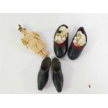A pair of Victorian child's leather shoes, size 7, a pair of doll's wooden and leather clogs, and