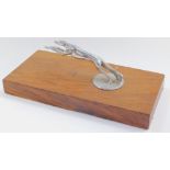 A Lincoln greyhound radiator cap mascot, c1930's, raised on a wooden base, 22cm wide.