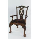 A Chippendale style mahogany doll's carver chair, with foliate carved back rail and splat,