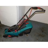 A Bosch Rotate 34 rotary electric lawn mower.