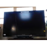 A Panasonic 21" colour TV in black trim, with wire and remote control.