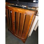 A mid 20thC walnut bow front china cabinet, 113cm high, 93cm wide, 34cm deep.