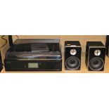 A Neostar Professional belt drive turn table with cassette radio CD recorder and USB encoding to com