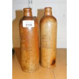 A pair of stoneware bottles, German stamped Georg Kreuzberg Ahrweiler Rheinpreussen, with circular s
