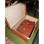 A brown leather trunk, leather brief case, writing case, etc.