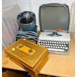 A Phillips heat lamp, a painted metal cash tin and a cased Adler typewriter. (3)