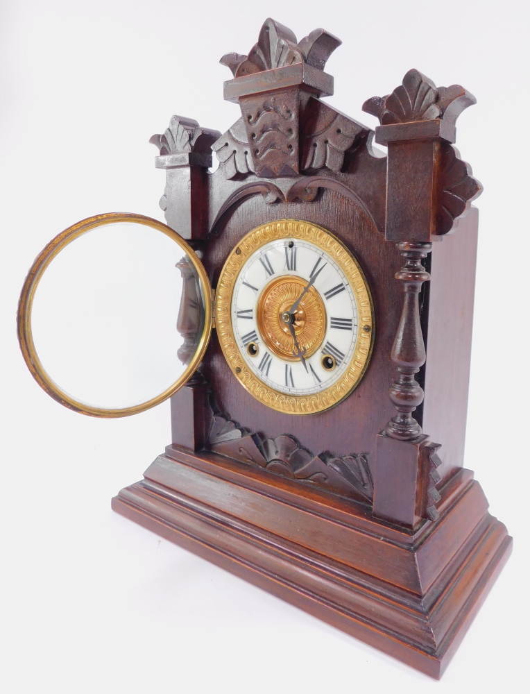 A late 19thC Ansonia Clock Company stained pine cased mantel clock, circular brass dial with enamel - Image 2 of 5