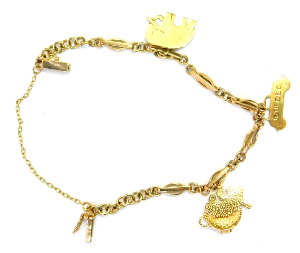 A 9ct gold charm bracelet, of fancy link design with three 9ct gold charms, to include a car dated