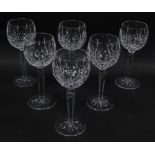 A set of six Waterford crystal wine glasses decorated in the Lismore pattern.