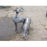 A pair of hollow cast metal figures of stag and doe, each in standing pose, 55cm high. (2)