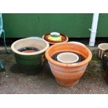 Various planters, a large pottery planter glazed in green with decorative panels 37cm high, a fire c