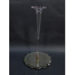 An early 20thC clear glass single trumpet epergne, raised on shaped mirrored base, 49.5cm high.