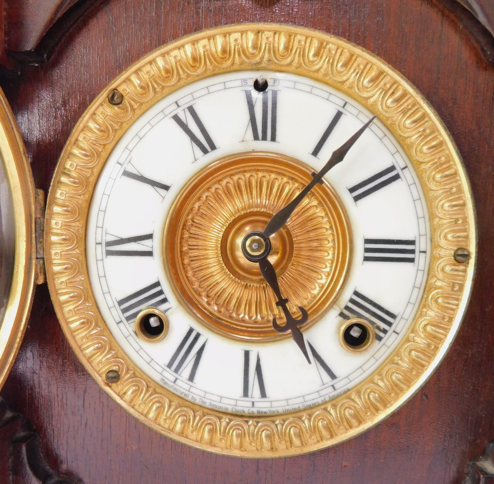 A late 19thC Ansonia Clock Company stained pine cased mantel clock, circular brass dial with enamel - Image 3 of 5
