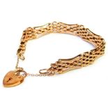 A 9ct rose gold gate bracelet, of multi curb link design, with outer elongated bent in borders, with