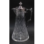 An Atlantis cut glass claret jug, with plated mount and hinged lid, embossed and engraved with flowe