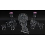 A group of Waterford crystal glassware, including a globular vase, two table bells, a mantel clock,