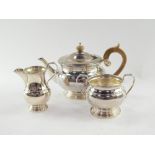 A silver three piece tea set, of circular form, maker CB and S, Sheffield assay, 33oz all in.