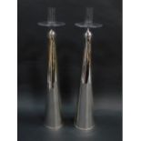 A pair of clear and silvered glass candlesticks, raised on slender out swept trumpet shaped stems, 5