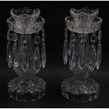 A pair of Waterford crystal lustres, with tear shaped drops, 25cm high.