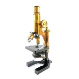 An E Leitz Wetzlar brass and black metal microscope, No 137717, cased with additional lenses, for Ch