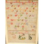 A Victorian alphabet sampler by Anne Penny, aged 12, dated 1871, depicting alphabets, a dog, cat and
