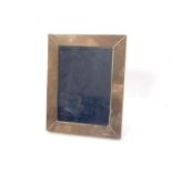 A rectangular silver easel photograph frame, maker Carrs of Sheffield, 18cm x 23cm.