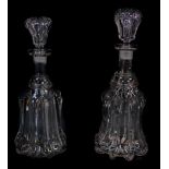 A pair of Victorian fluted cut glass mallet shaped decanters, with stoppers, 32cm high.