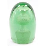 A Victorian green glass and sulphide dump paperweight, decorated with a baluster vase on a plinth, 1