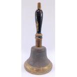 A vintage brass school bell, with an ebonised wooden turned handle. 34cm high.