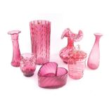 A group of Victorian and later cranberry glass, including a fluted vase, further vases, one with a f