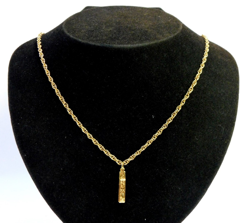 A 9ct gold pendant and chain, the pendant of rectangular design, with various twist panels, floral e