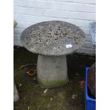 A modern staddle stone, of mushroom shaped form, the domed top on a square base 54cm high, 50cm diam