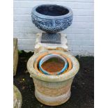 A pair of concrete bench sections, and a classic design urn of circular form on square form, 37cm hi