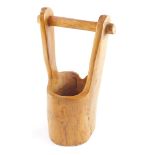 A rustic vintage carved wooden water pail, 43cm high.