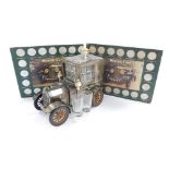 A tinplate Ford vintage car liqueur set and two Historic Car Coin Collections.