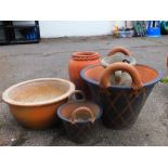 Planters, garden ornaments, etc., a fire clay vase with rope twist rim, 40cm high, two handle plante