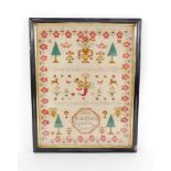 A Victorian pictorial and motto sampler by E A Mann, dated Octiber 1885, set with trees, heart borde