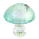 An art glass mushroom paperweight, having an iridescent dome top mounted with a silver coloured meta