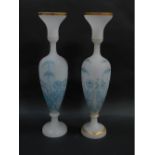 A pair of Victorian frosted opaline glass baluster vases, with gilt rims and necks and highlighted i