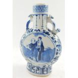 A 19thC Chinese Qing dynasty porcelain moon flask, with moulded handles and painted panels set with