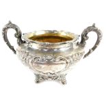 A William IV Scottish silver sugar bowl, of twin handled form, with shield reserves, embossed framed